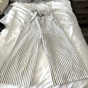 Woman pant romper.  Pinstriped white and black.